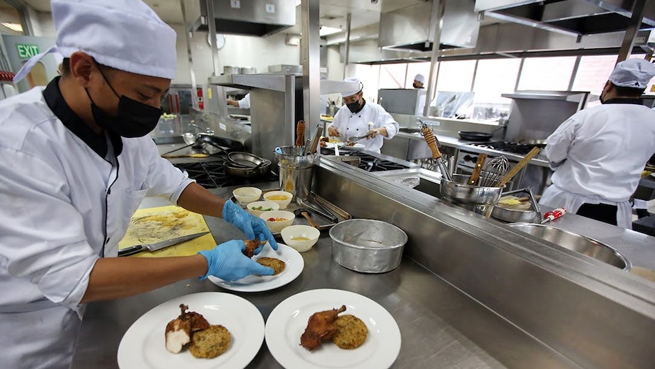 Chefs preparing food in the kitchen