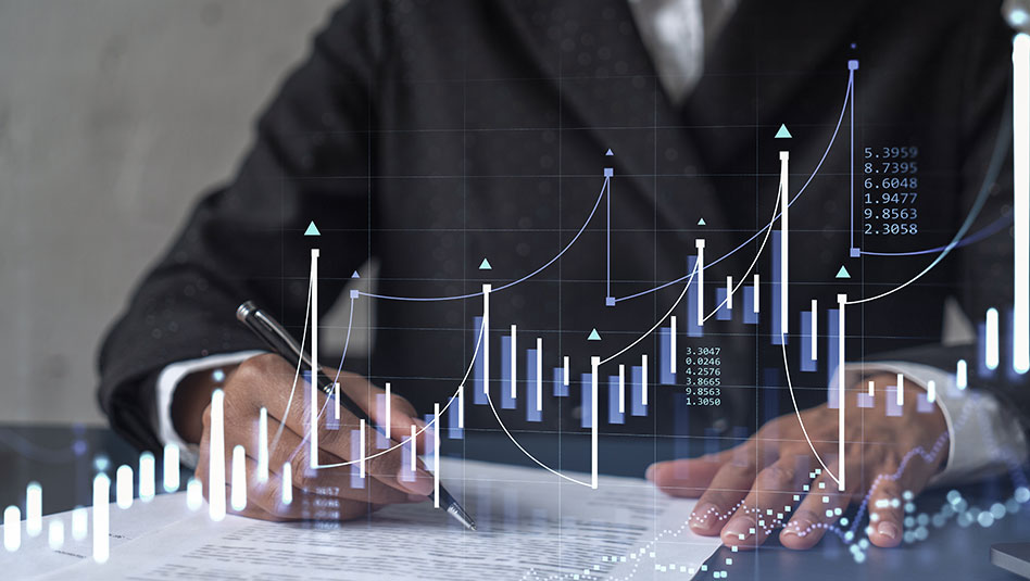 Man on desk with a pen with superimposed image of a bar graph